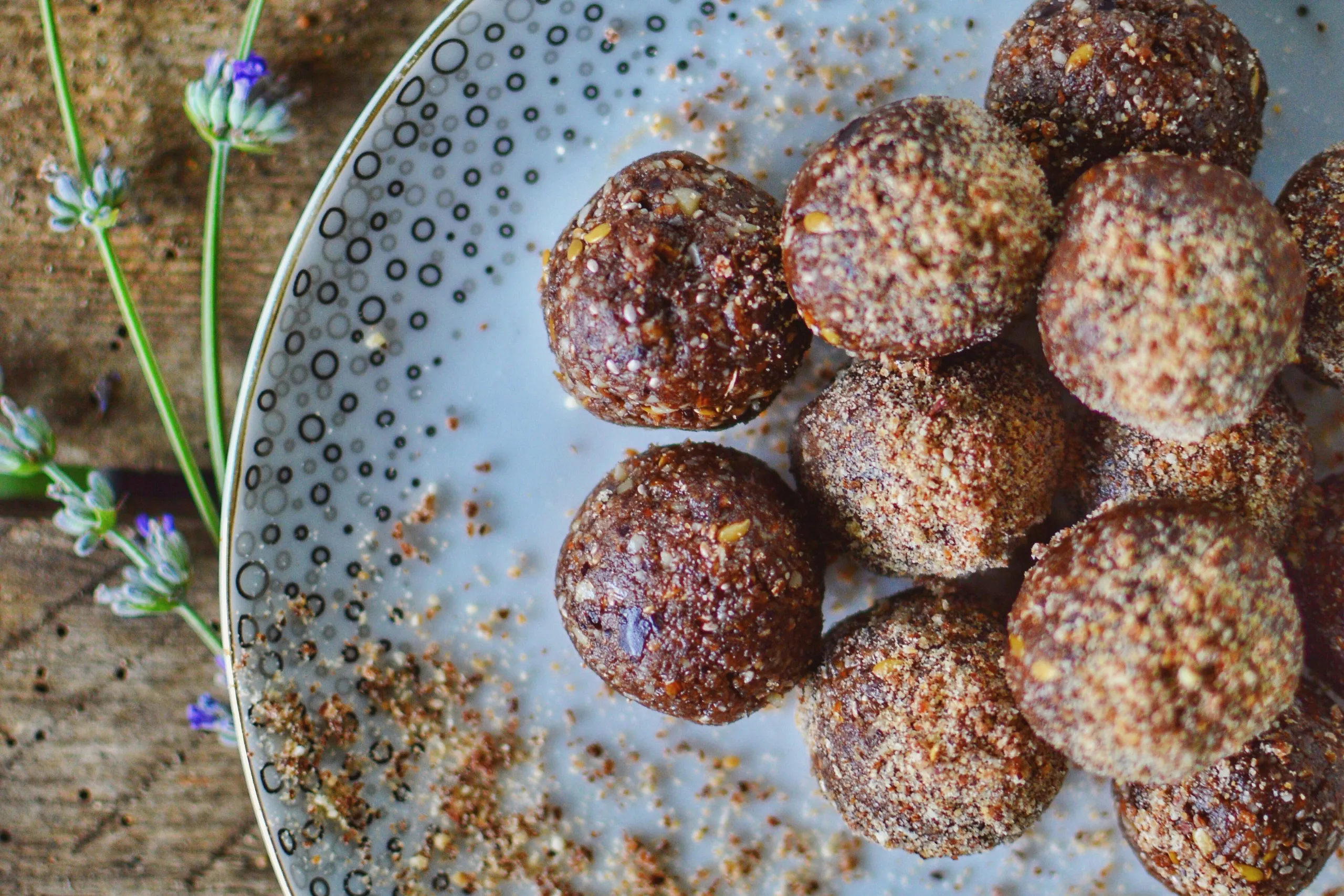  fresh dates and a glass of water placed on a table, traditional foods for breaking fast during Ramadan.