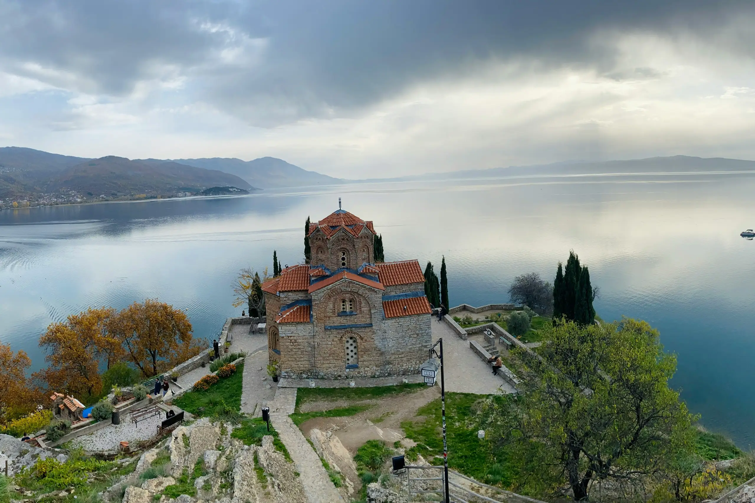 A festive Christmas tree featuring bright ornaments and a playful unicorn nestled among the branches