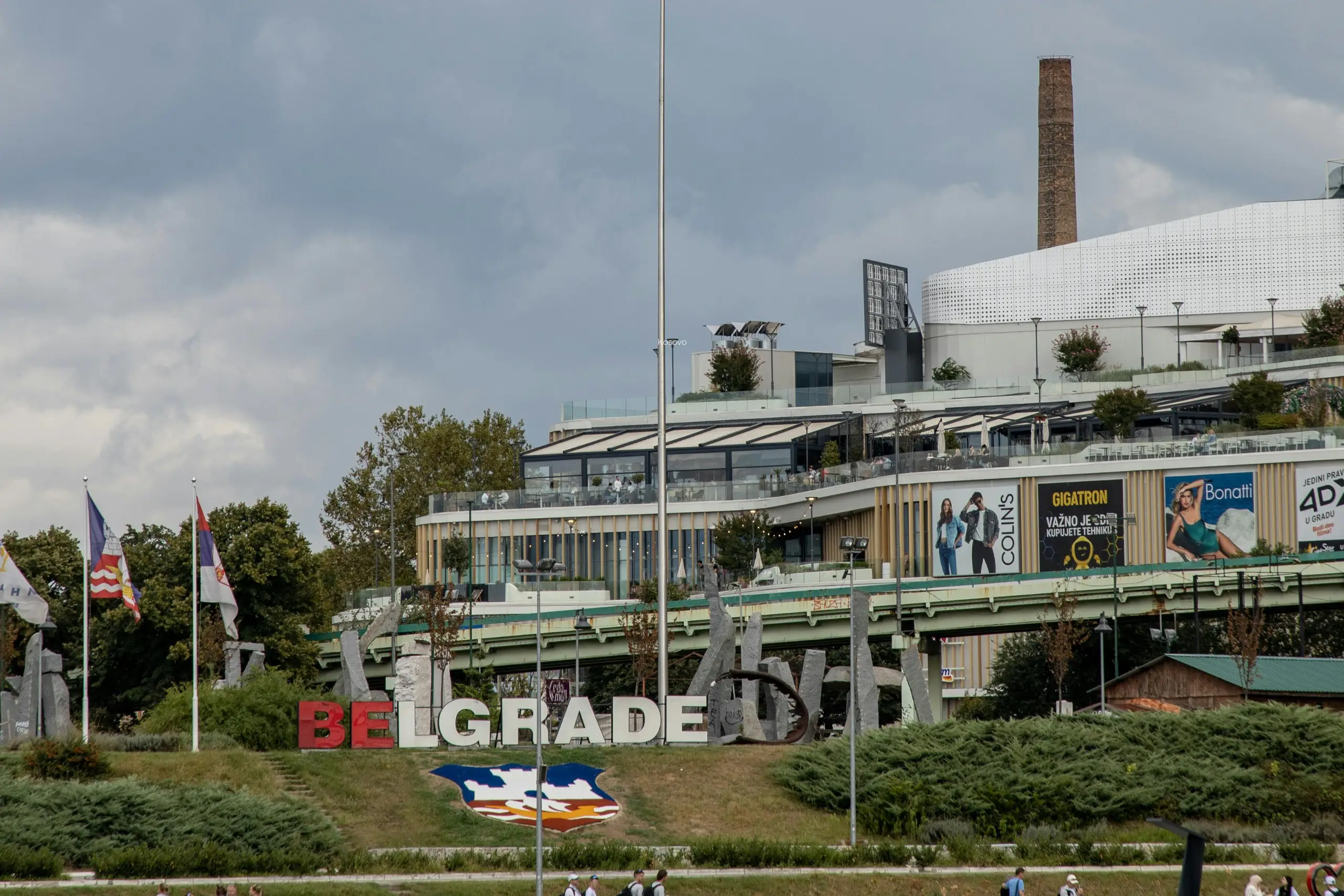 A festive Christmas tree featuring bright ornaments and a playful unicorn nestled among the branches