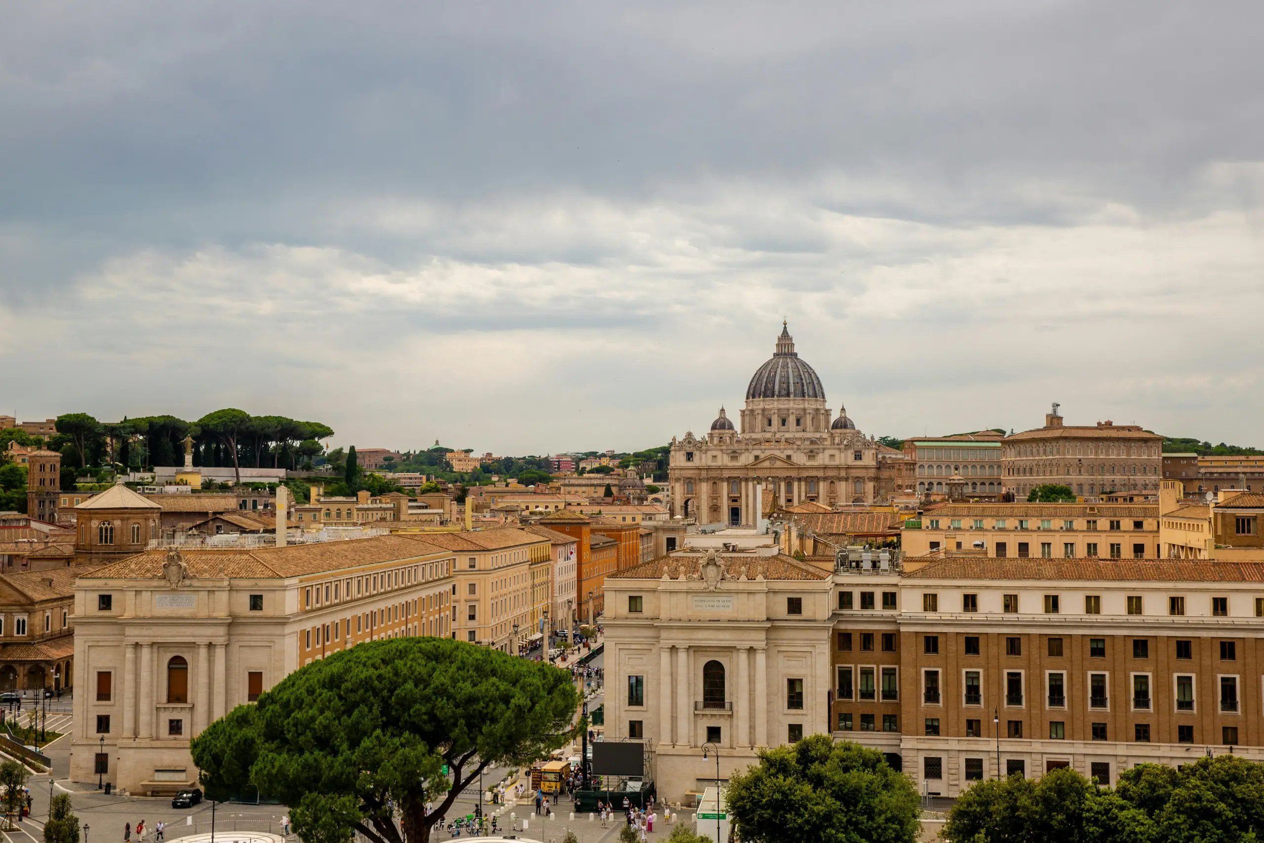 A festive Christmas tree featuring bright ornaments and a playful unicorn nestled among the branches