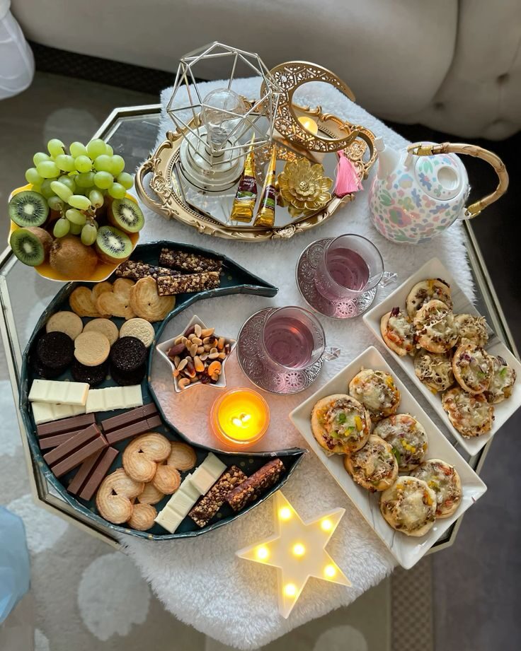 A festive Eid table filled with desserts like Baklava, Ma’amoul, Gulab Jamun, and Kheer arranged for celebration